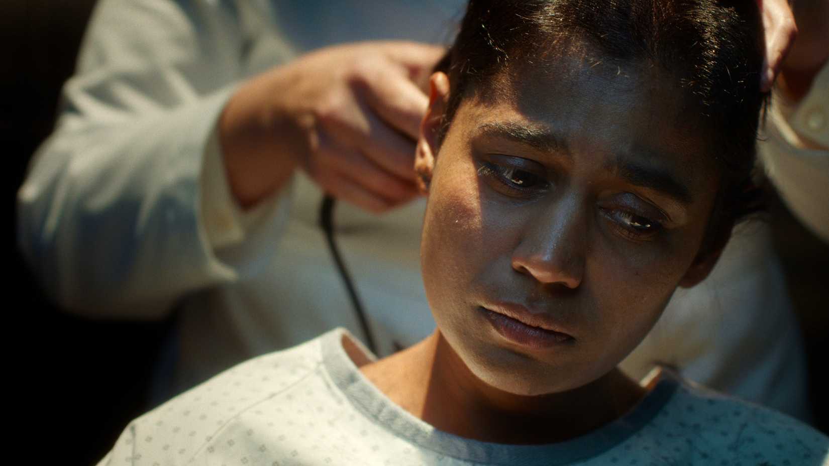 Kali's hair being shaved off in Stranger Things.