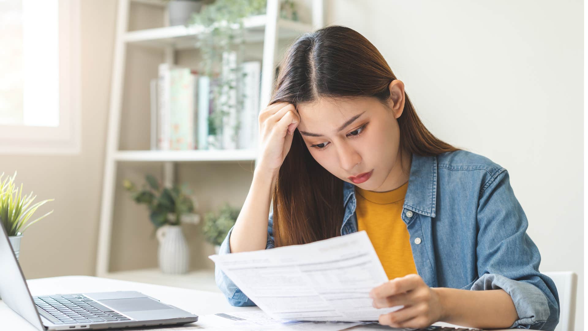 woman who is falling behind financially avoiding talking about upcoming bills or due dates