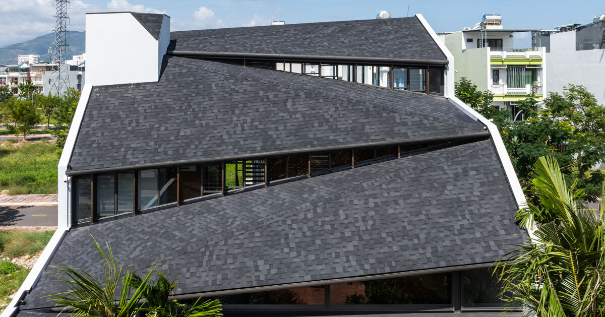 tent house expands under overlapping roof planes in vietnam