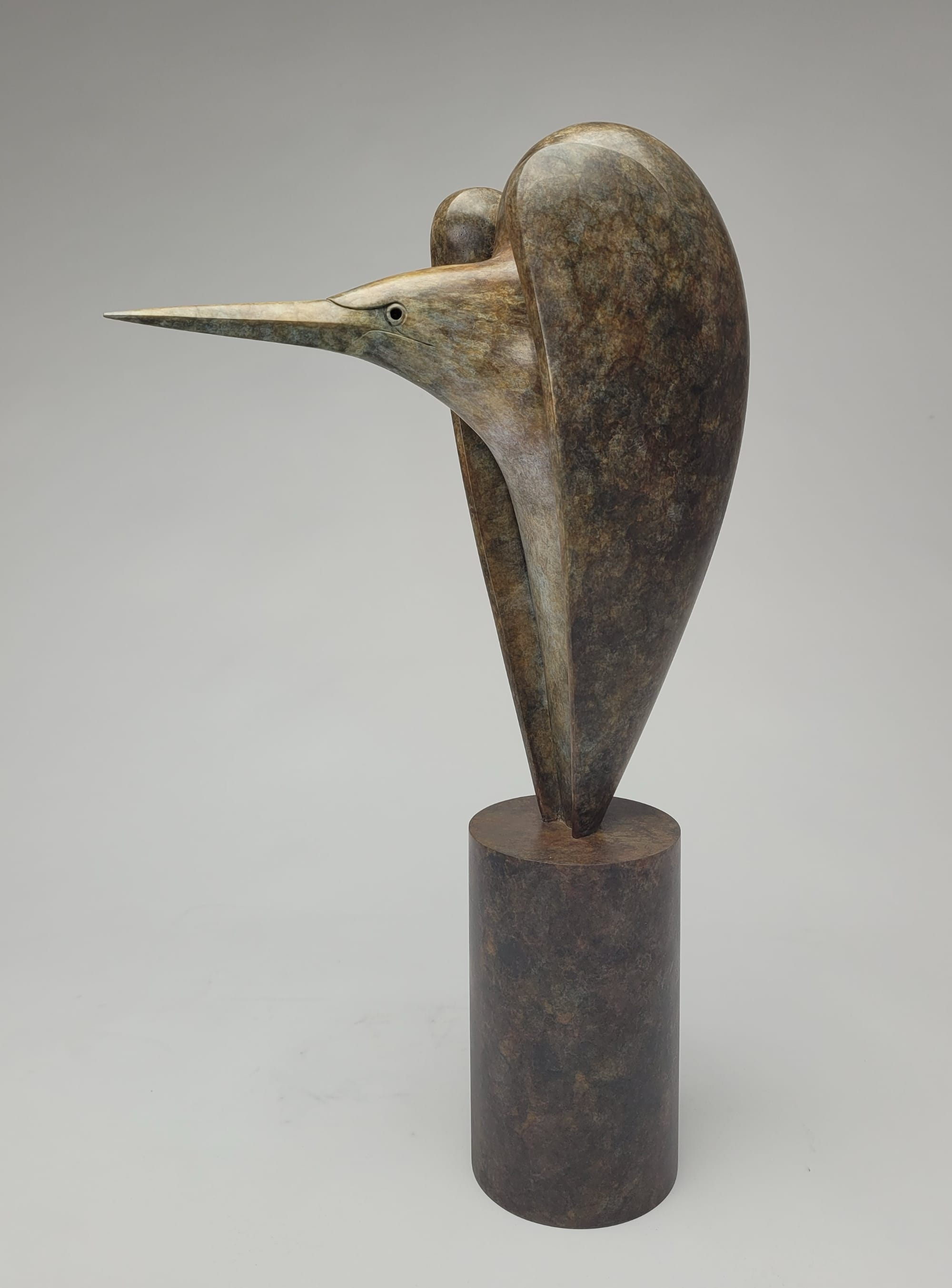 a bronze bird sculpture by Anthony Theakston