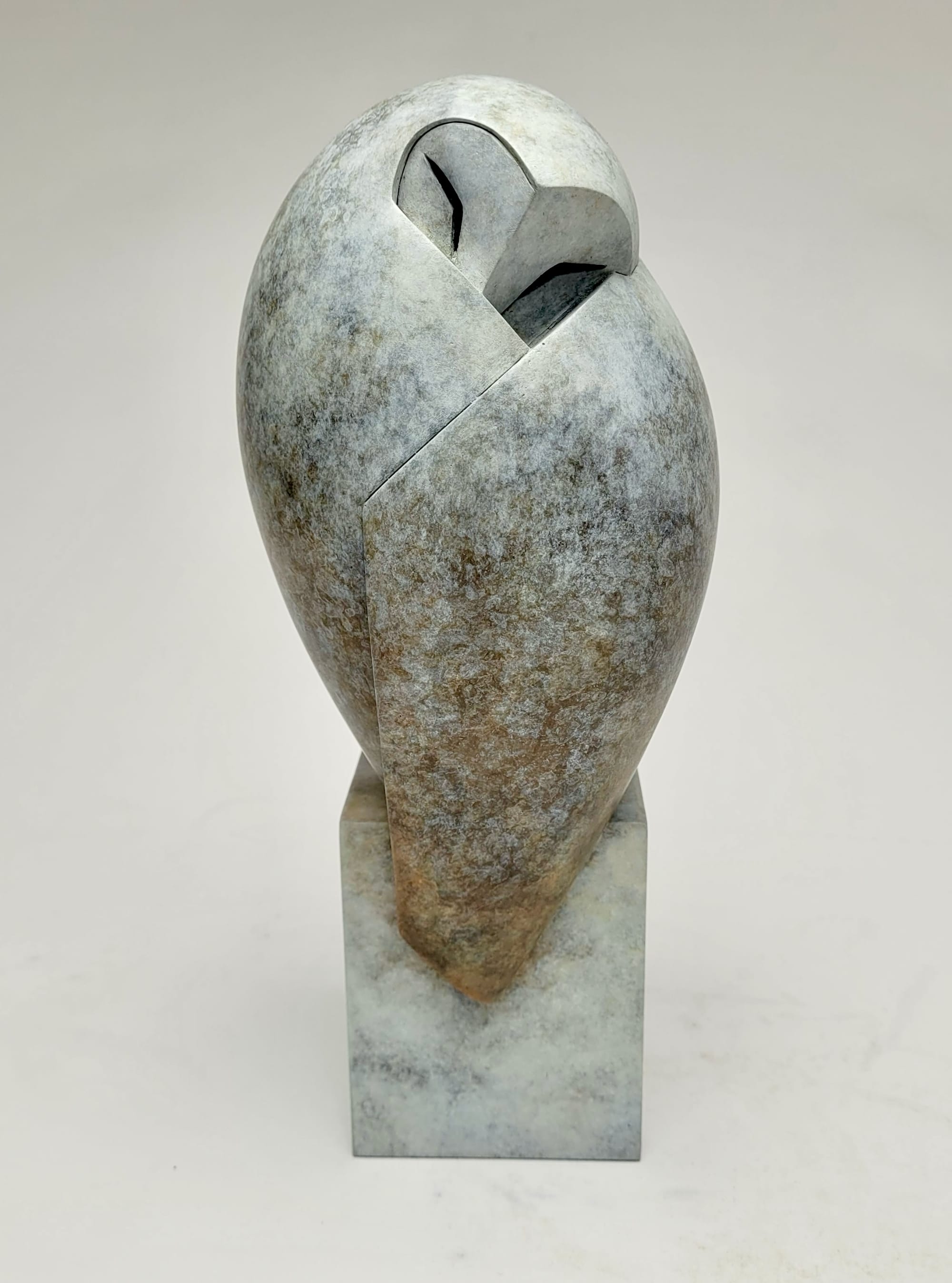 a stone owl sculpture by Anthony Theakston