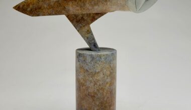 a stone owl sculpture by Anthony Theakston