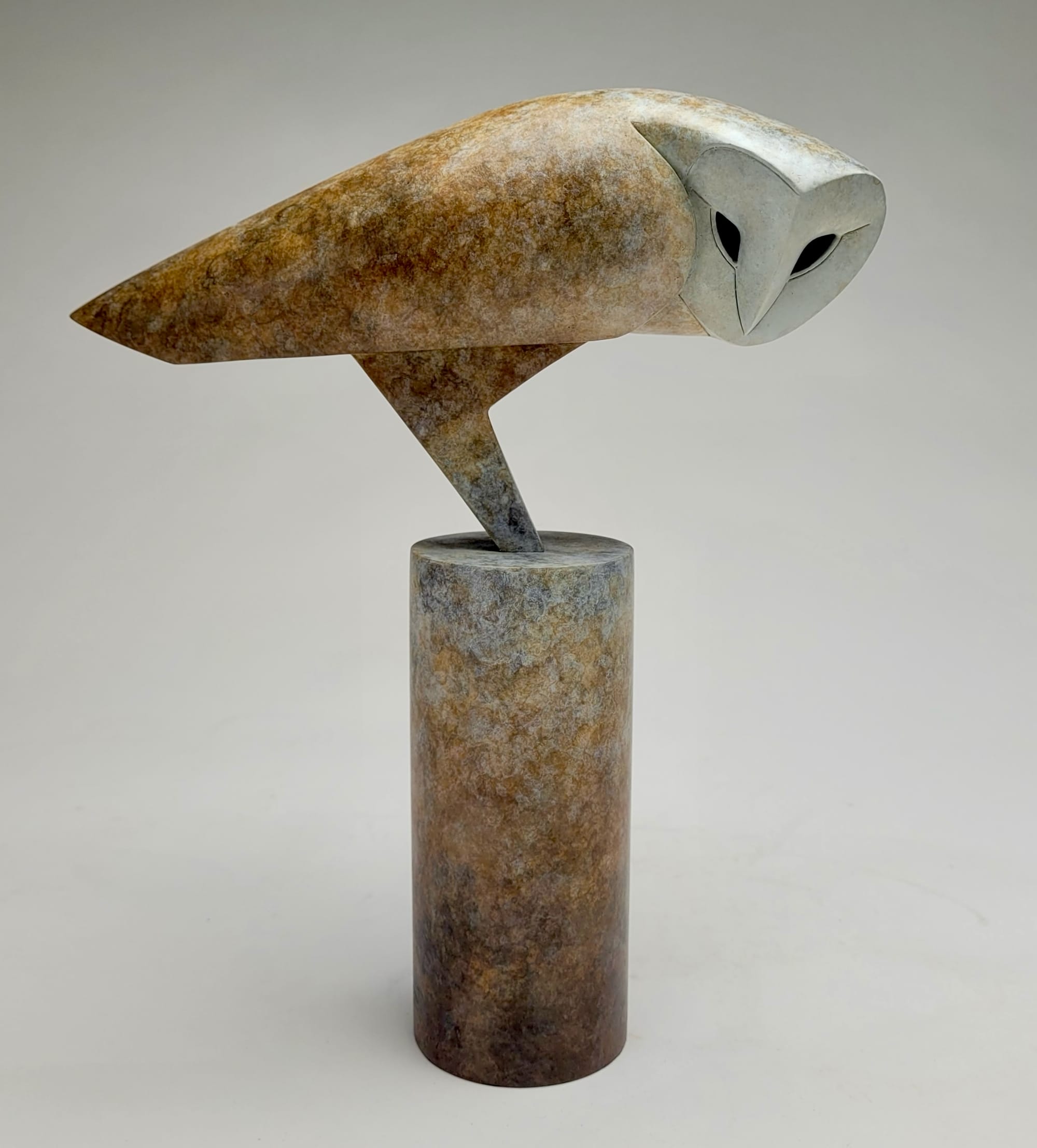a stone owl sculpture by Anthony Theakston