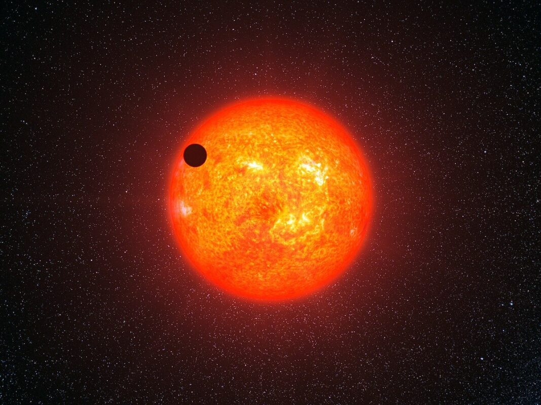 This Artist's Impression Shows How Gj 1214 B May Look As It Transits Its Parent Star