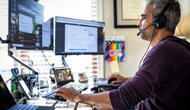 investor trading in their portfolio on two screens