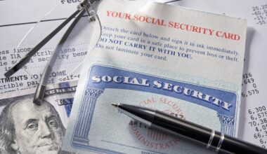 A Social Security card laying on a financial statement with a pen, glasses, and $100 bill.