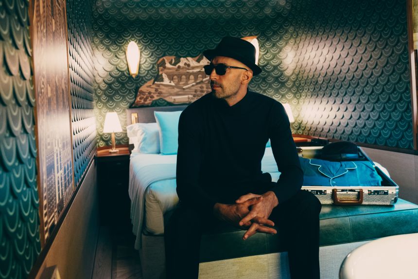 JR inside the bedroom of