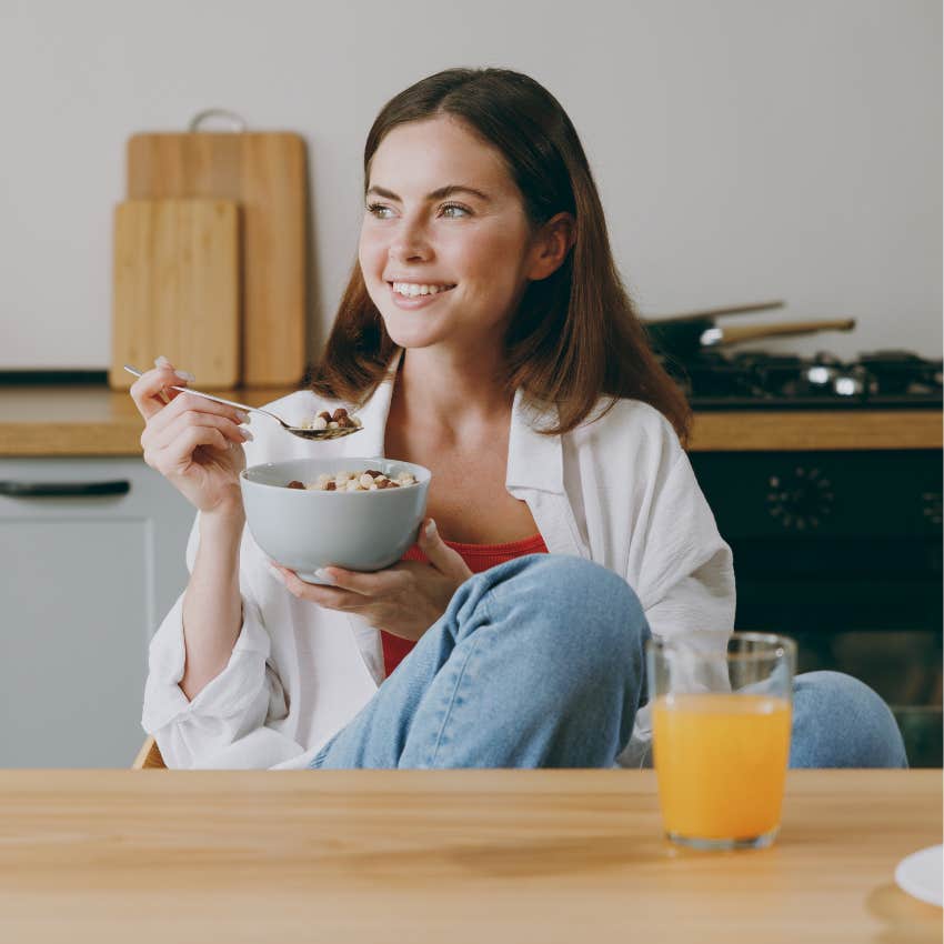 woman who is a healthier person as she eats breakfast daily