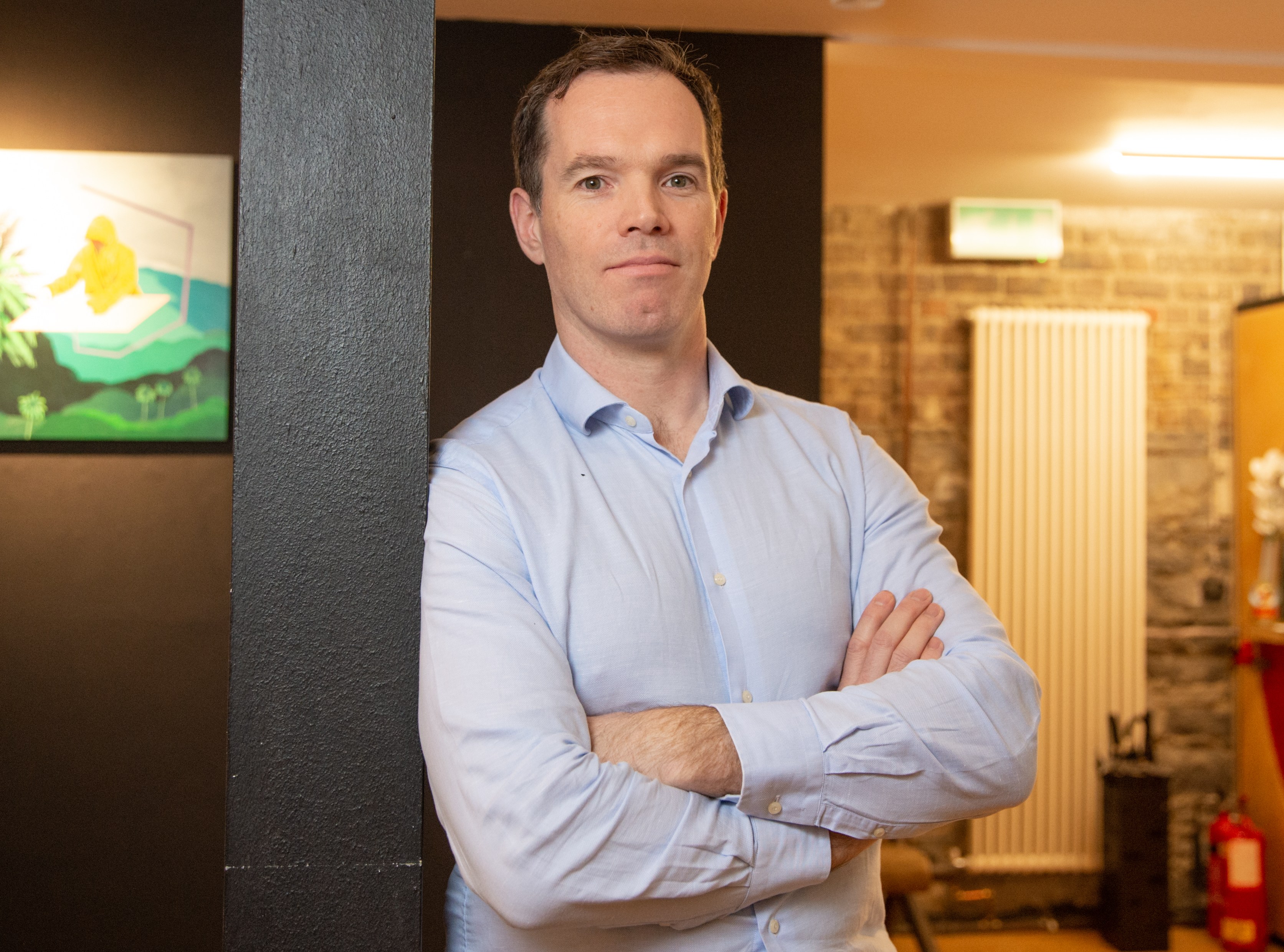 Alan Coleman, a tech entrepreneur, stands with arms crossed.