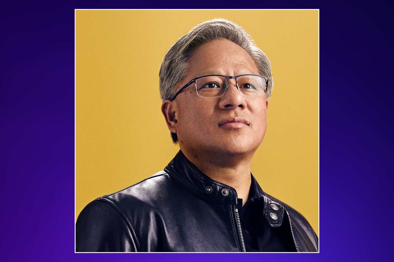 Headshot of an older man with gray hair and glasses wearing a black leather jacket.