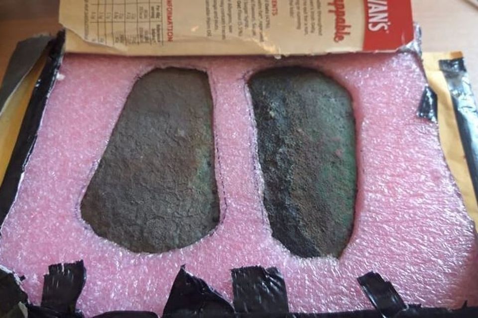 Bronze Age axe-heads sent anonymously to the National Museum of Ireland in 2024, packaged in a used Flahavan’s box. They were found in Westmeath with a metal detector