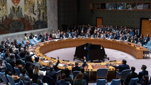 Members of the UN Security Council raise their hands to vote in favor of a draft resolution to authorise an International Stabilization Force in Gaza