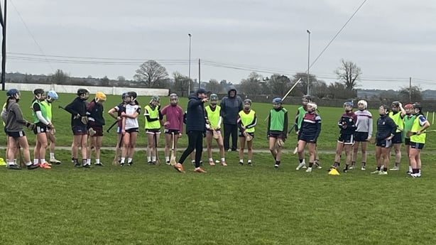 Athenry camogie players in a huddle
