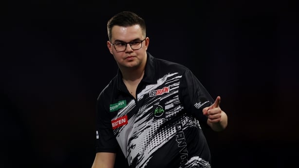 Gian van Veen of the Netherlands reacts against Gary Anderson of Scotland (not pictured) during their semi-final match at Alexandra Palace on January 02, 2026 in London, England.