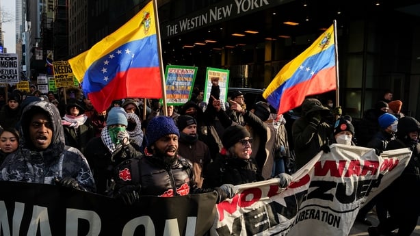 Demonstrators during a protest in Times Square in New York, US, on Saturday, Jan. 3, 2026. President Nicolas Maduro has been charged in the US after he was captured and flown out of Venezuela, following a series of airstrikes that mark an extraordinary escalation in the Trump administration's months