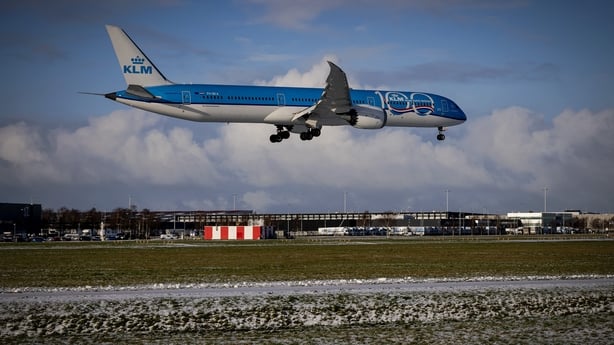 A plane of KLM airlines lands at the Schiphol Airport on January 4, 2026 as hundreds of flights have been cancelled due to the winter weather