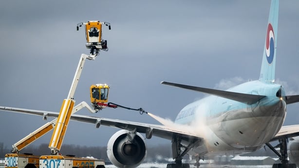 An aircraft being de-iced at Schiphol Airport 