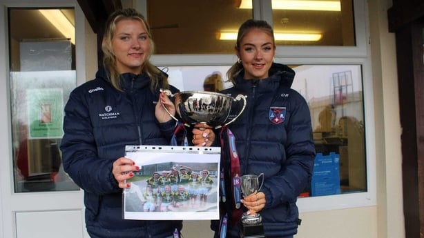 Sabina and Olwen Rabbitte with picture of Cumann na Bunscoil winning team and trophy.