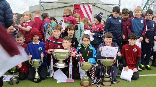 Pupils with the Bill and Agnes Carroll Cup and the O Duffy Cup.