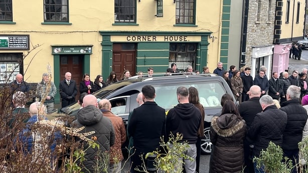 The funeral cortege of Stephen McCahill passes his Corner House pub