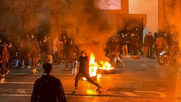 Iranians gather while blocking a street during a protest in Tehran, Iran on January 9, 2026