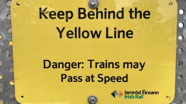 A safety sign about trains