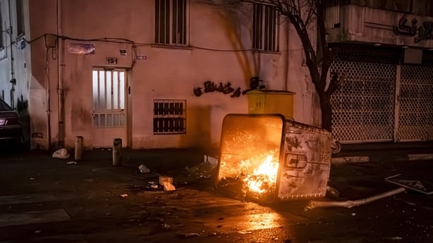 A bin on fire during protest in Tehran, Iran