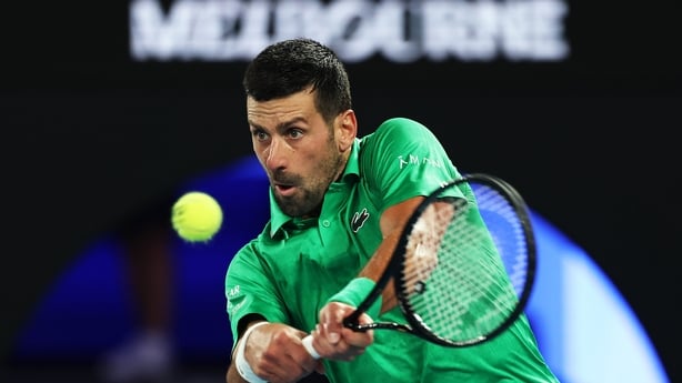 MELBOURNE, AUSTRALIA - JANUARY 24: Novak Djokovic of Serbia plays a backhand against Botic van de Zandschulp of the Netherlands during the Men's Singles Third Round match on day seven of the 2026 Australian Open at Melbourne Park on January 24, 2026 in Melbourne, Australia. (Photo by Phil Walter/Get