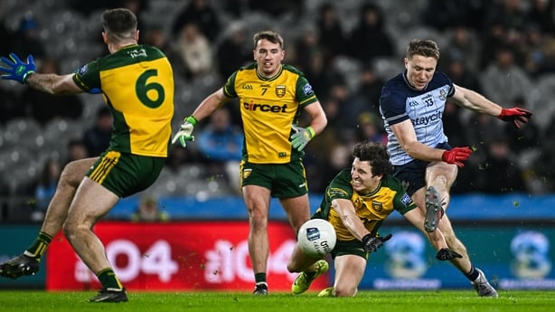  Paddy Small of Dublin shoots at goal, under pressure from Donegal's Finnbarr Roarty - 2026 Allianz Football League