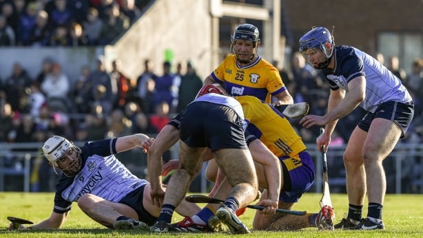25 January 2026; Dublin and Clare players tussle for the ball during the Allianz Hurling League Division 1B match between Clare and Dublin at Zimmer Biomet Páirc ChÃosóg in Ennis, Clare. Photo by John Sheridan/Sportsfile
