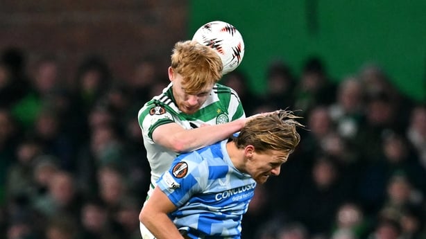 Celtic's Irish defender #05 Liam Scales jumps to head the ball with FC Utrecht's Dutch midfielder #20 Dani de Wit during the UEFA Europa League league-stage football match between Celtic and FC Utrecht at Celtic Park in Glasgow on January 29, 2026
