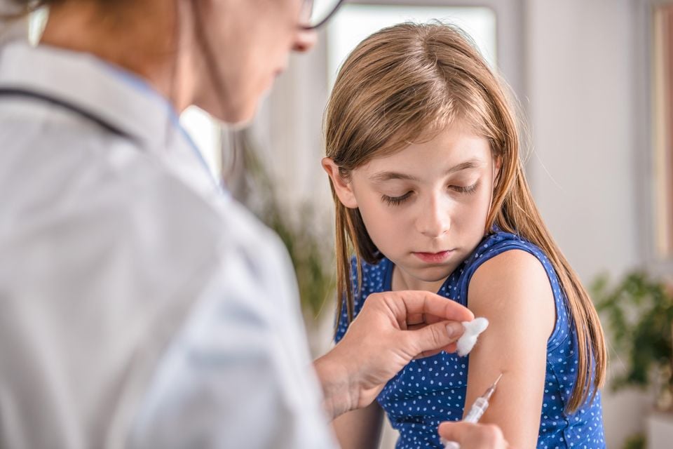 Image of a child receiving the flu vaccine. Stock image
