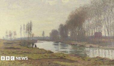 Claude Monet's painting called The Petit Bras of the Seine at Argenteuil (1872). It depicts a green river with marshland and brown bog to the left of the river. There are two black silhouettes crouched and standing by the river. The trees are bare.