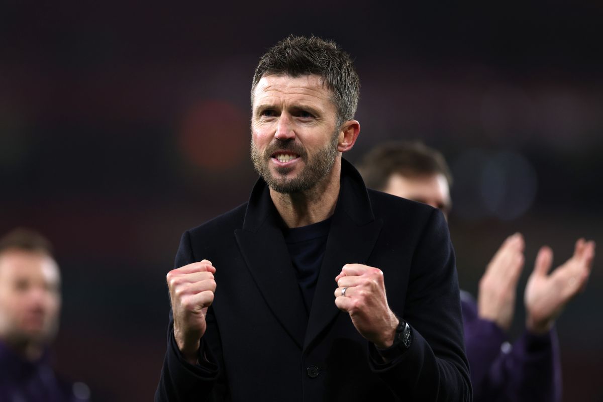 Michael Carrick, Head Coach of Manchester United, celebrates as he shows appreciation to the fans following the team's victory in the Premier League match between Arsenal and Manchester United