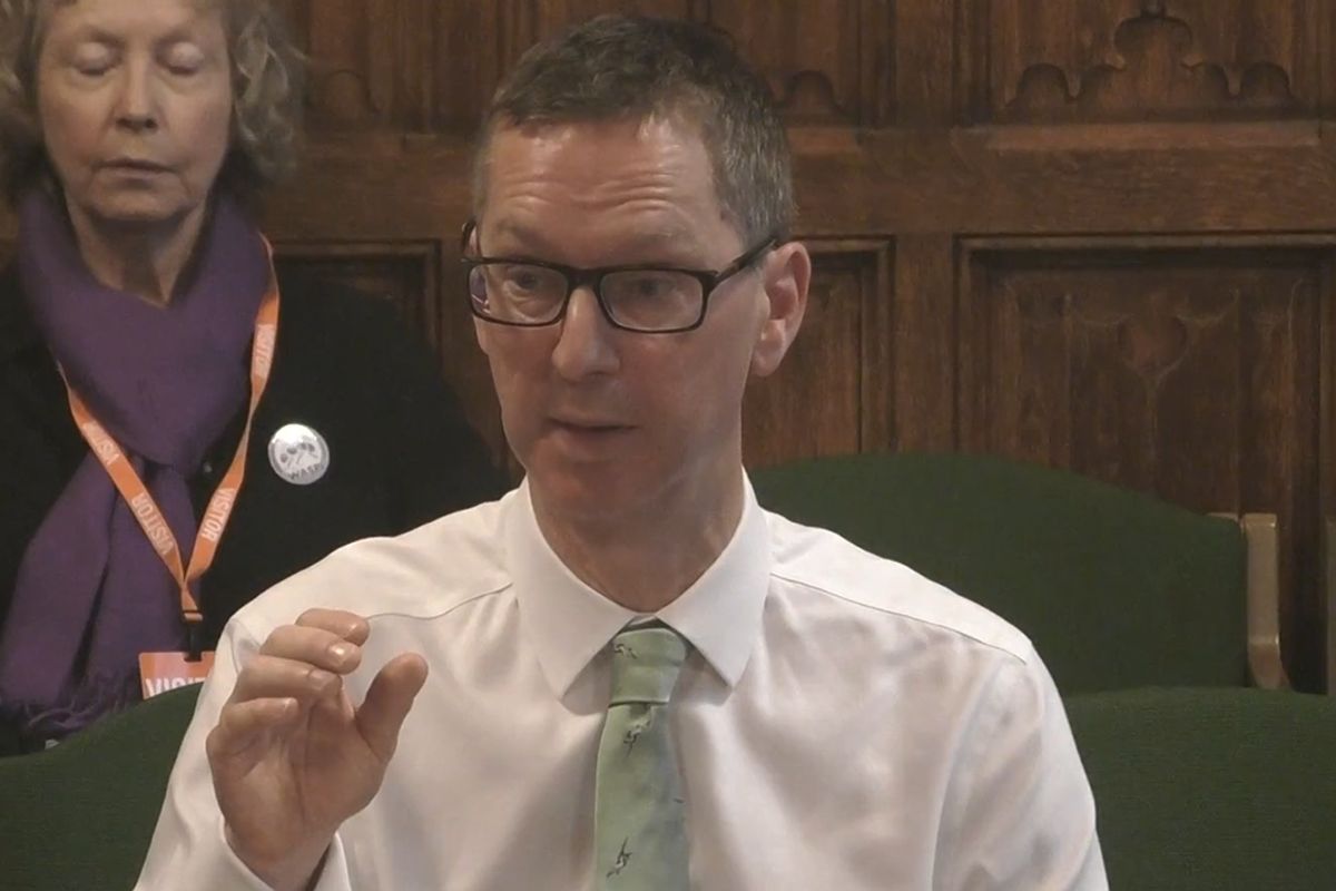 DWP permanent secretary Peter Schofield speaking to MPs