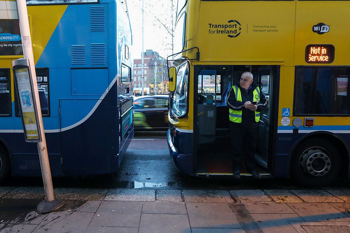 A bus driver stands in the doorway of his bus at a bus stop in Dublin, Ireland, on Thursday, Nov. 24, 2016. Irish ministers and executives are closely monitoring economic and market developments in the U.K. because the country is Irelands largest trading partner along with the U.S. Photographer: Chris Ratcliffe/Bloomberg via Getty Images