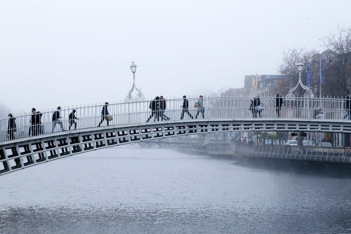 The Ha'penny bridge on a foggy morning in Dublin City, Ireland - stock photo