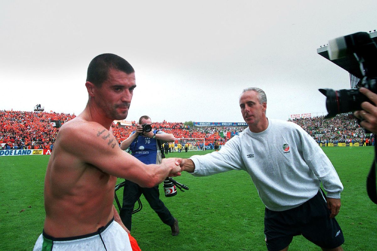Roy Keane shakes hands with manager Mick McCarthy.