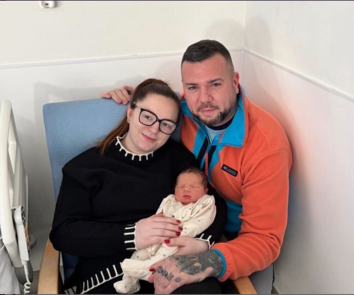Parents Kasey Grant and Stephen Kirwan with baby Ollie Micheal Kirwan, who were all rescued by boat from their apartment in Enniscorthy, Co Wexford on Tuesday morning.