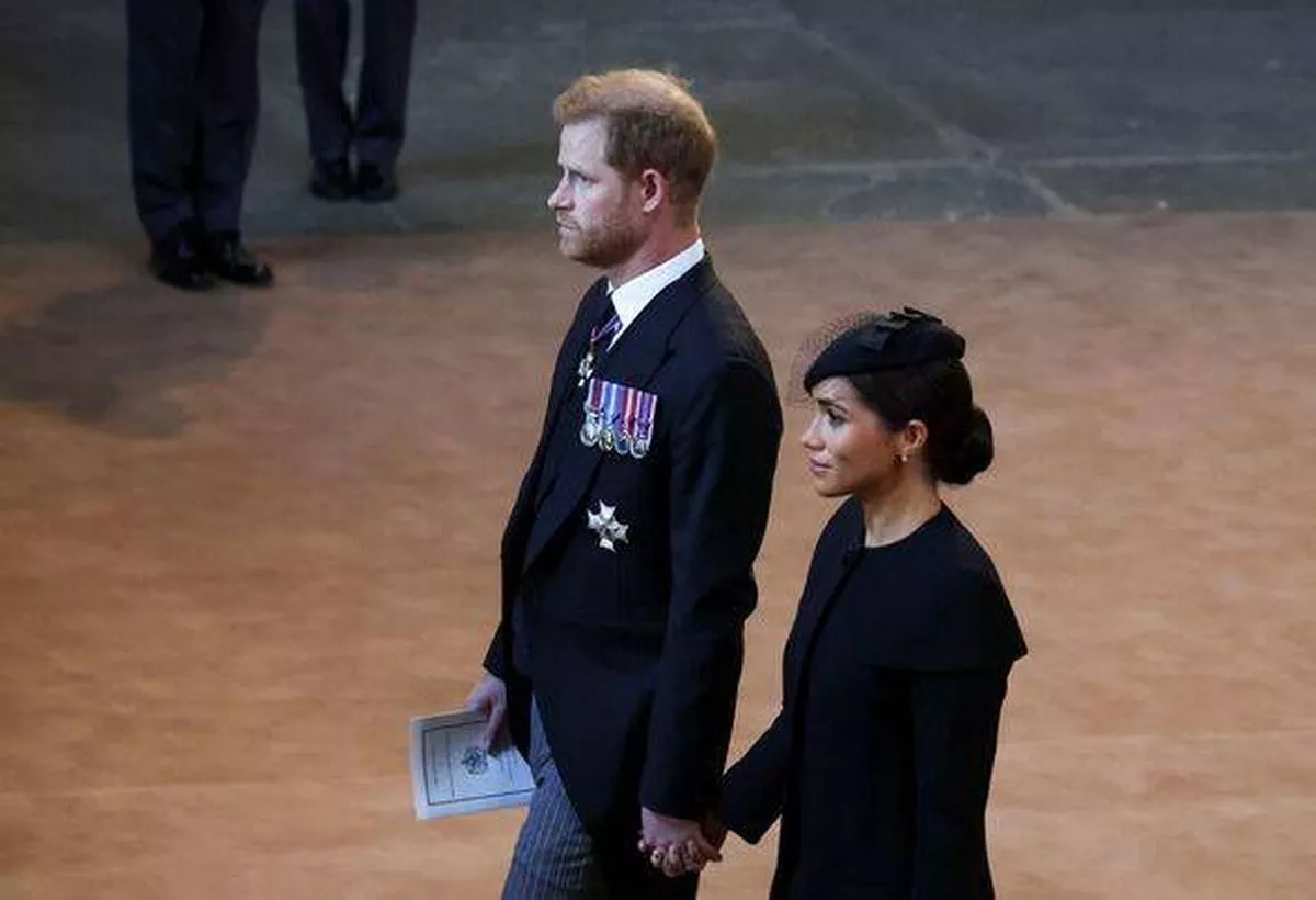 Meghan and Harry holding hands