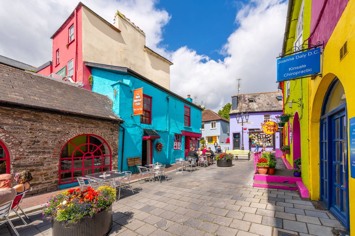 Newman's Mall, a small square off of Pearse and Market Streets full of cafes and shops in the brightly painted seaside village of Kinsale, Ireland.