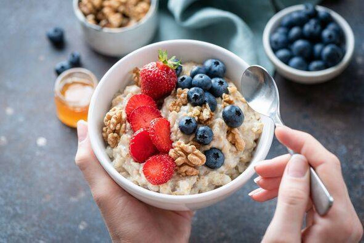 Oatmeal porridge bowl with berry fruits.