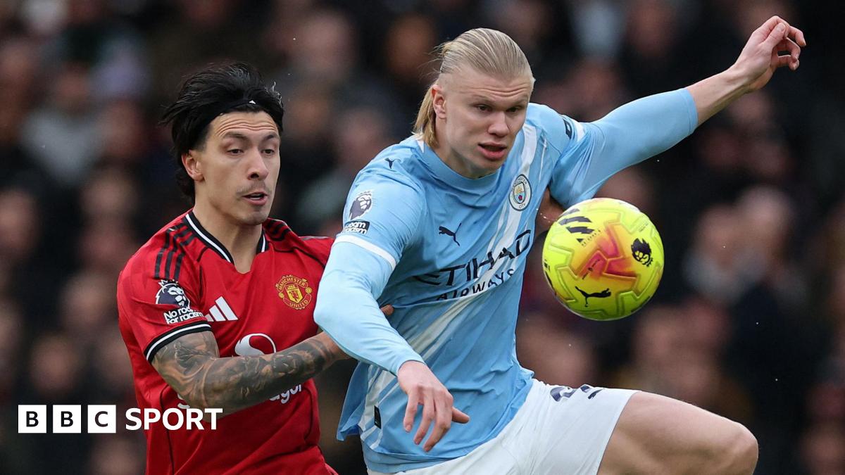 Lisandro Martinez and Erling Haaland fight for possession in the Manchester derby