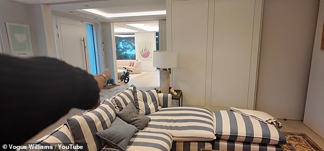 As for the kitchen, Vogue proudly showed off her pink cupboards and marble island, with the hub of the home also having a lounge area with a huge TV and fireplace