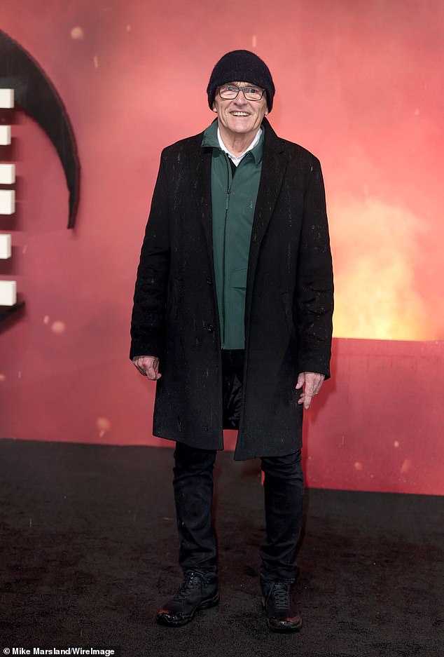 Danny, an Oscar winner for this 2008 hit Slumdog Millionaire, wrapped up against the elements