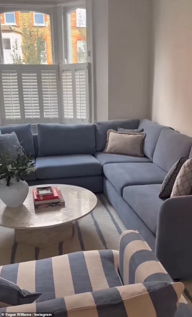 Vogue showed off the 'cosy' room transformation which featured a stylish blue L-shaped sofa and a coordinated blue and white striped arm chair