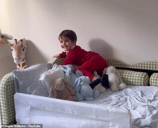 Heading into her youngest child Otto's new bedroom in the rented temporary home, he looked thrilled as he sat on his green and white checked bed