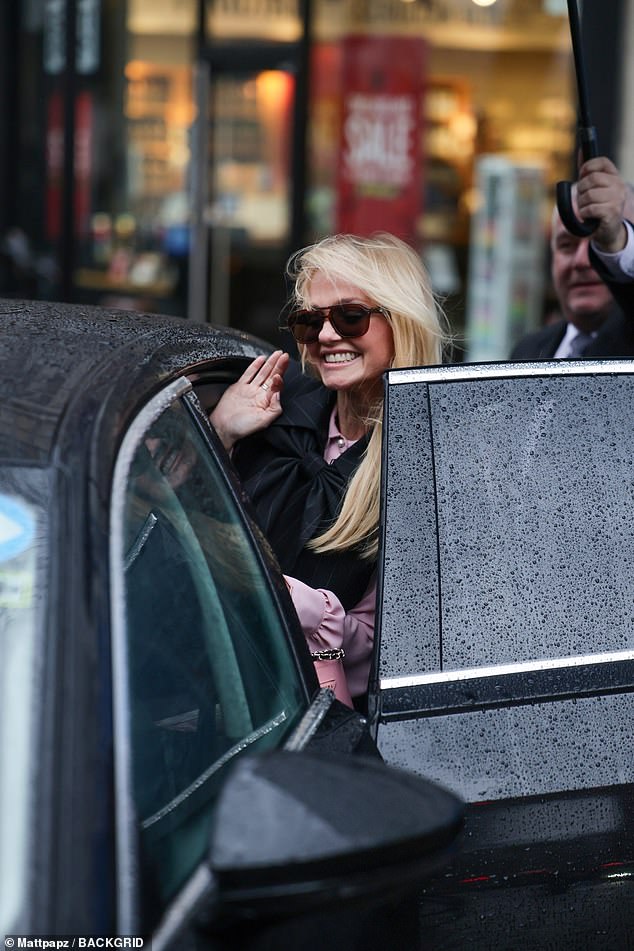 Looking radiant despite the rainy weather, Emma waved to the cameras before she and Jade got into a waiting car