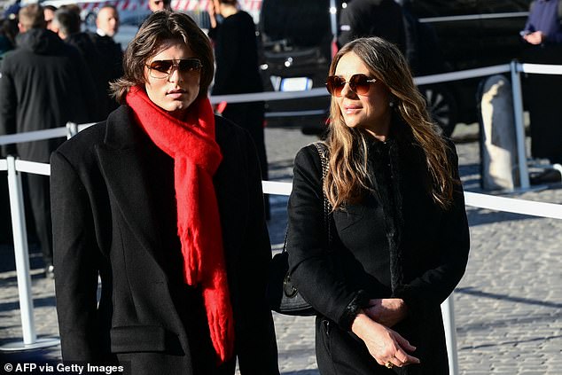 Elizabeth Hurley and her son Damian set out to pay their respects, with Damian adding a touch of Valentino red to his outfit