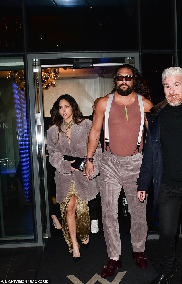 Jason braved the weather in a dusty pink vest and velvet suit trousers with white braces